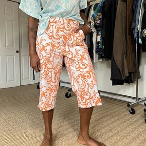 Orange and white floral design capri shorts. Size small but fits like a medium.